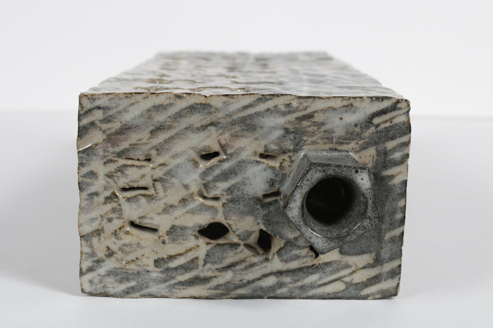 Narrow Vessel with Four Legs and Cut-Out Motif <br>1988 Cermaic <br><br>#B5965