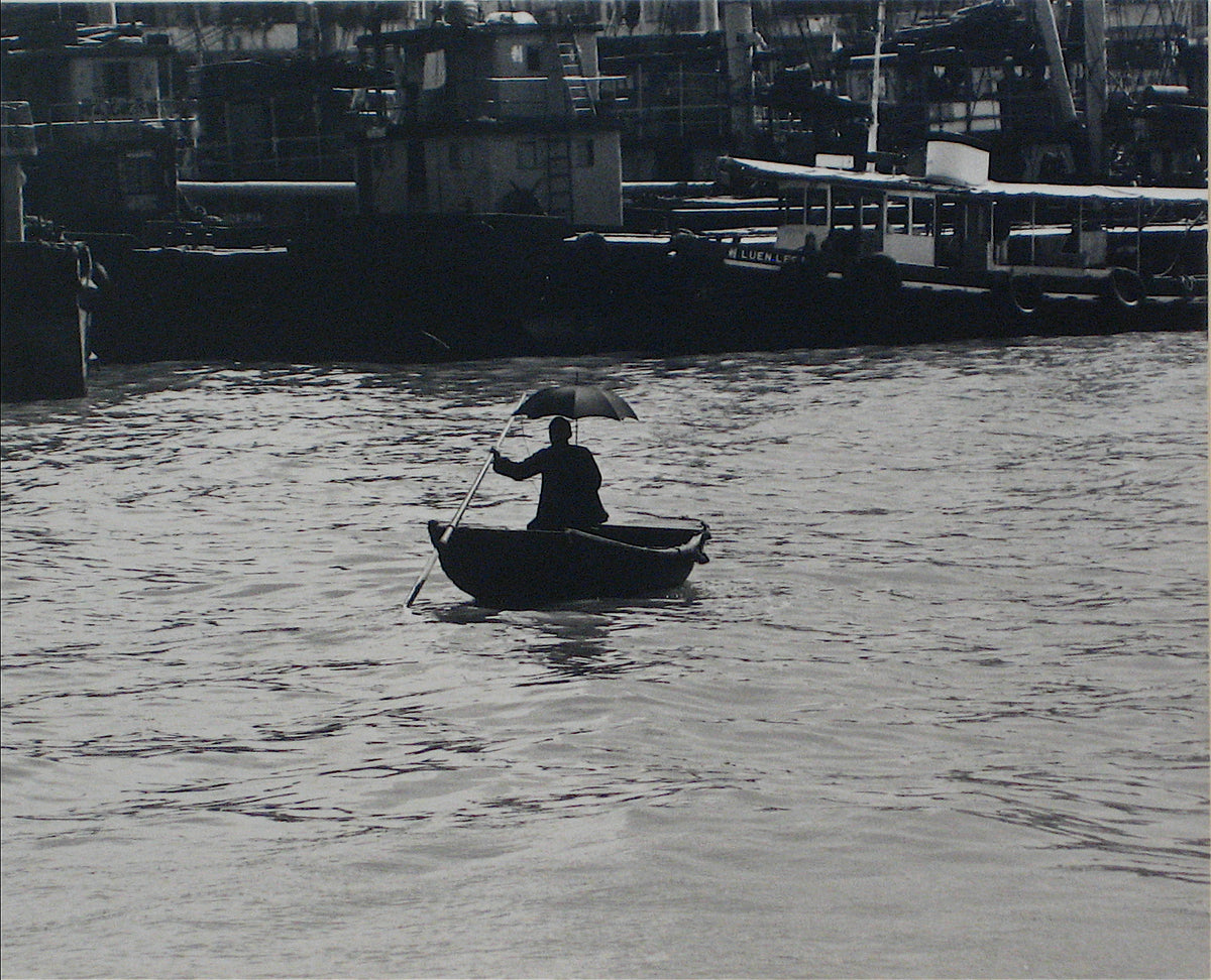 Silhouetted Figure with Umbrella in Canoe &lt;br&gt;1960s Silver Gelatin Print &lt;br&gt;&lt;br&gt;#12269