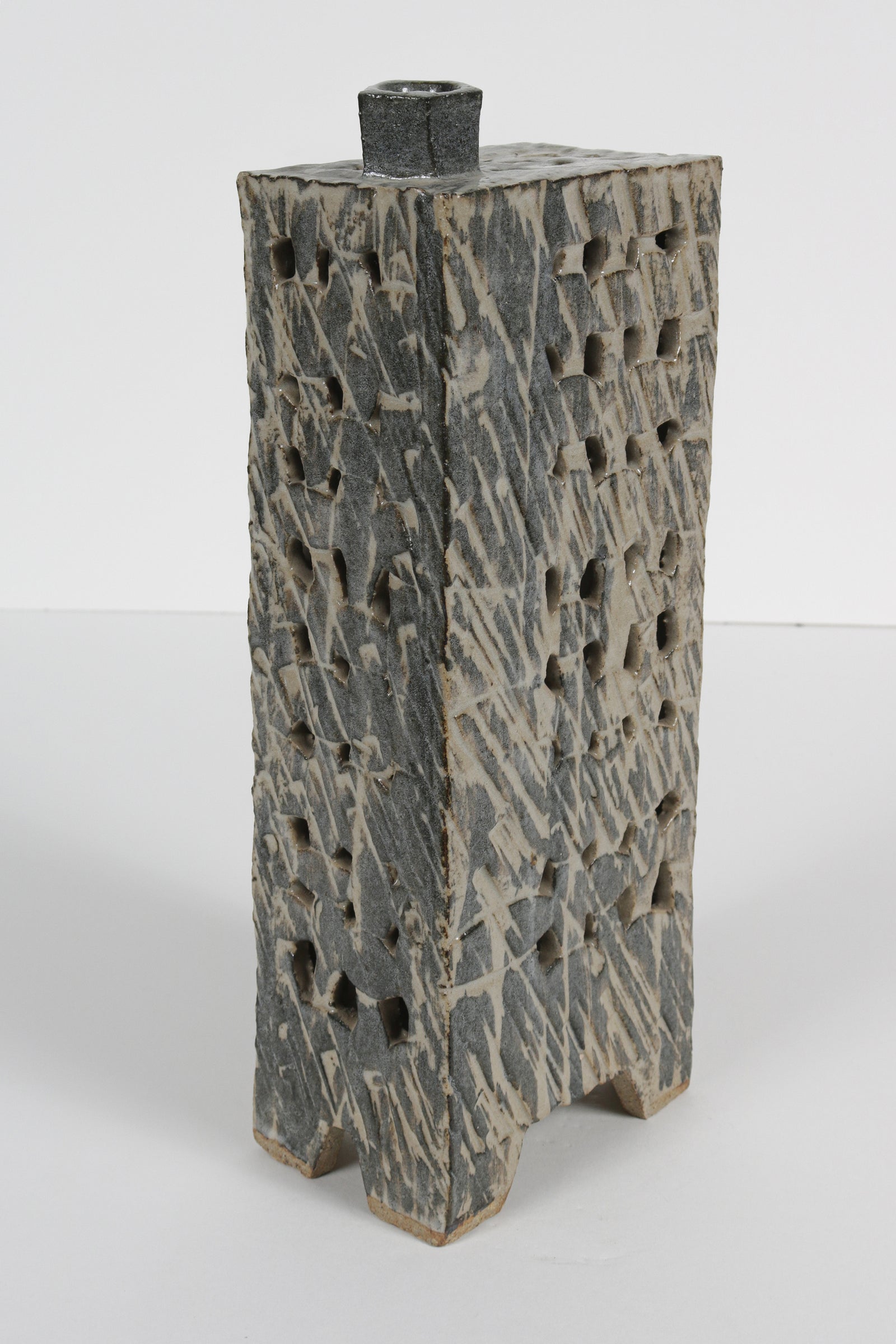 Narrow Vessel with Four Legs and Cut-Out Motif <br>1988 Cermaic <br><br>#B5965