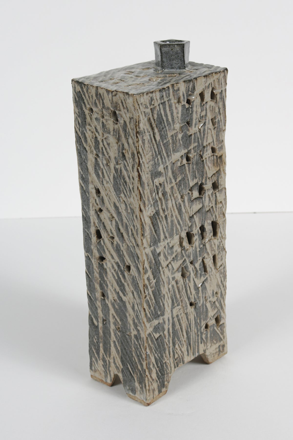 Narrow Vessel with Four Legs and Cut-Out Motif <br>1988 Cermaic <br><br>#B5965