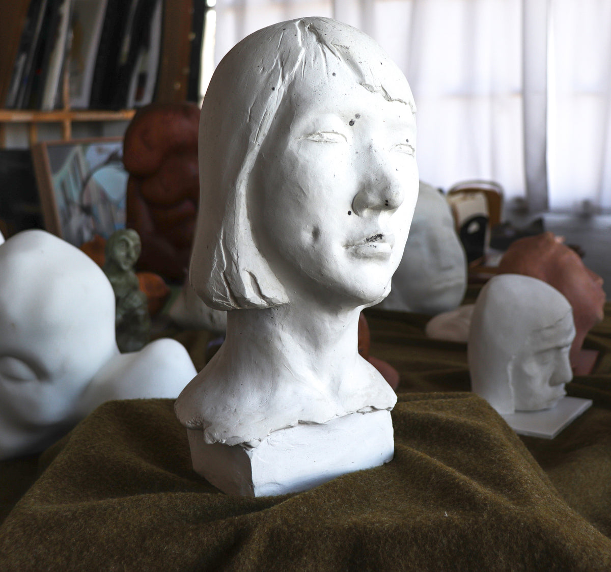 Thoughtful Feminine Bust <br>20th Century Plaster <br><br>#C2785