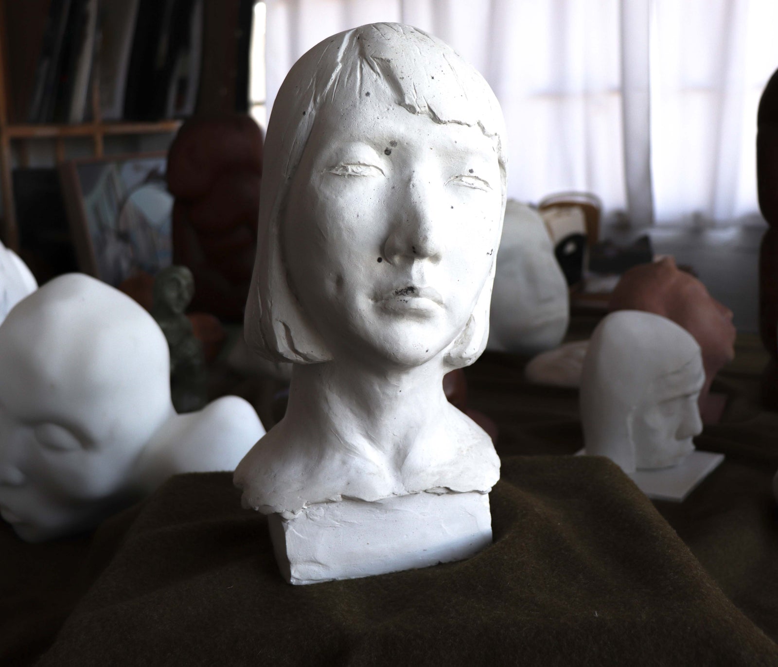 Thoughtful Feminine Bust <br>20th Century Plaster <br><br>#C2785