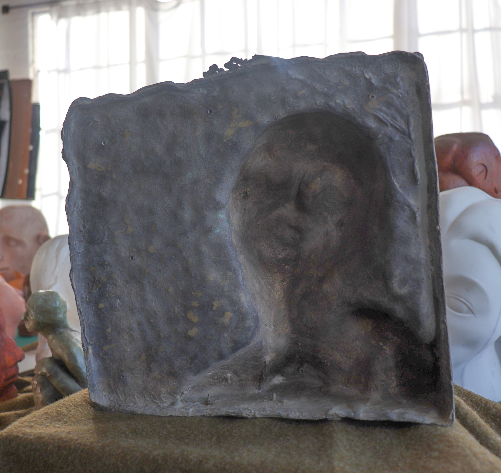 Emerging Restful Figure <br>20th Century Brass Plate <br><br>#C2973